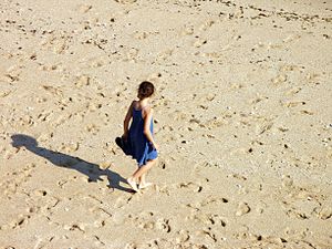 English: Girl walking in a beach. Porto Covo, ...